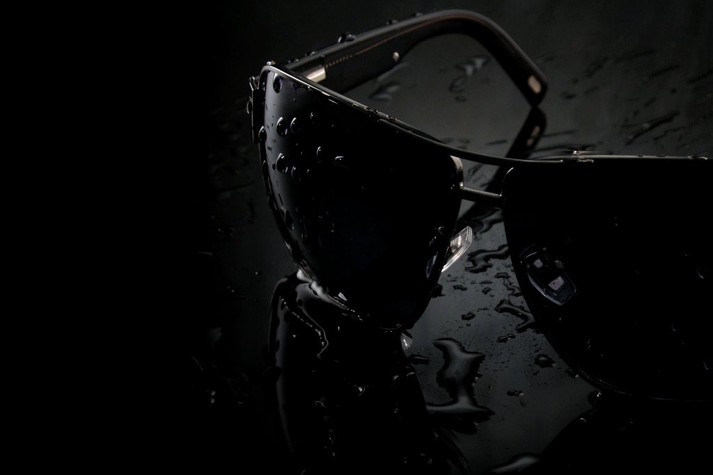 sunglasses with water drops covering them