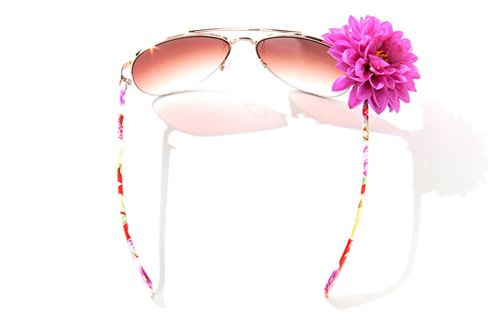 A pair of sunglasses with a flower